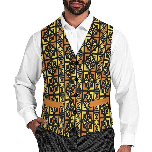 A man wearing a white dress shirt and a patterned waist vest with a geometric design in yellow, black, and brown, paired with dark patterned trousers against a white background.
