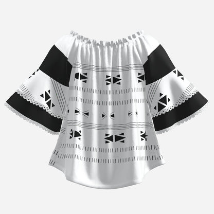 A women's off-the-shoulder blouse with a white base, black geometric tribal patterns, and black solid shoulder panels, finished with scalloped lace trim.