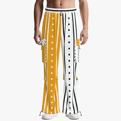A model wearing wide-leg pants with a bold yellow and white vertical stripe pattern, featuring white buttons down the front and side cargo pockets, shot against a light gray background.