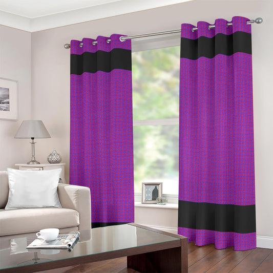 A pair of purple and black grommet curtain panels hanging on a silver rod in a living room setting with a sofa, lamp, and coffee table visible.