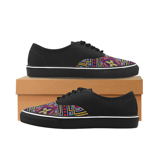 A pair of black low-top canvas sneakers with a colorful geometric pattern on the toe box, displayed on a brown shoebox against a white background.