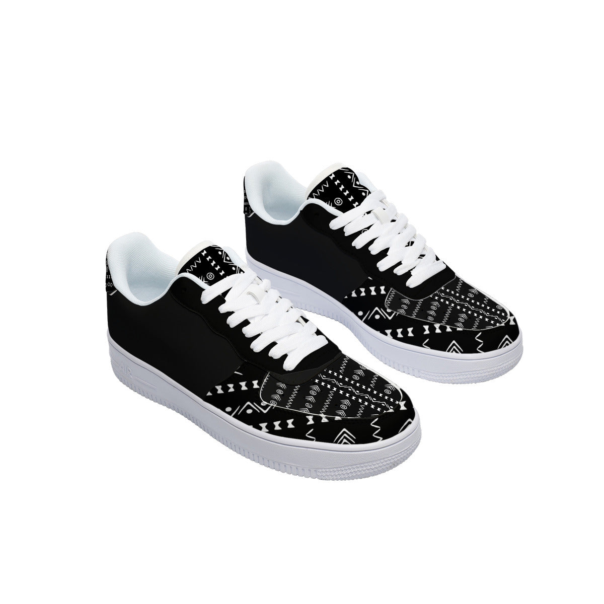 A pair of low-top sneakers with a black canvas upper featuring a white geometric tribal-style pattern, white laces, and white soles, shown against a plain white background.