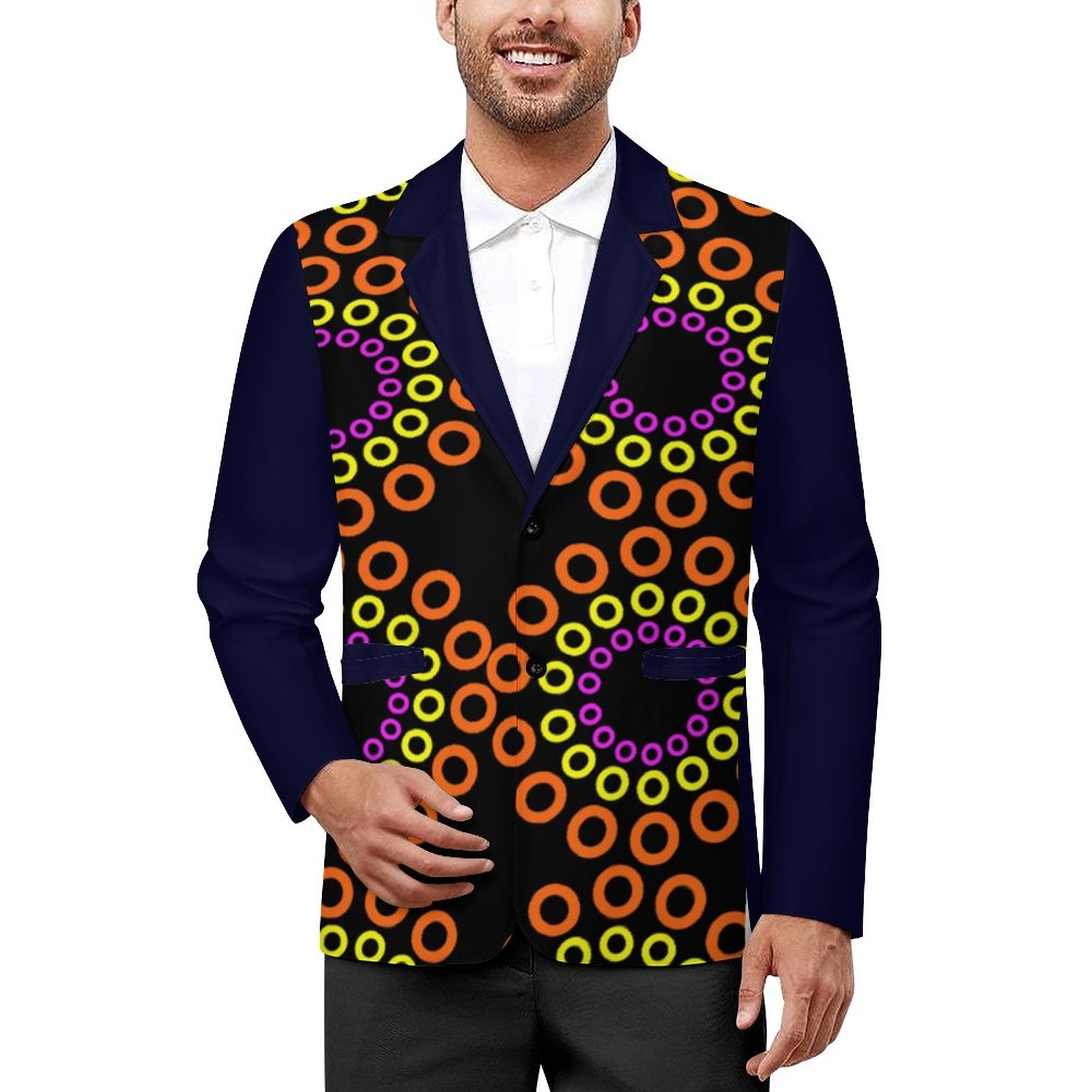 A man wearing a custom printed blazer vest with a navy blue collar and sleeves, and a black body covered in a colorful pattern of orange, yellow, and purple concentric rings, styled over a white collared shirt.