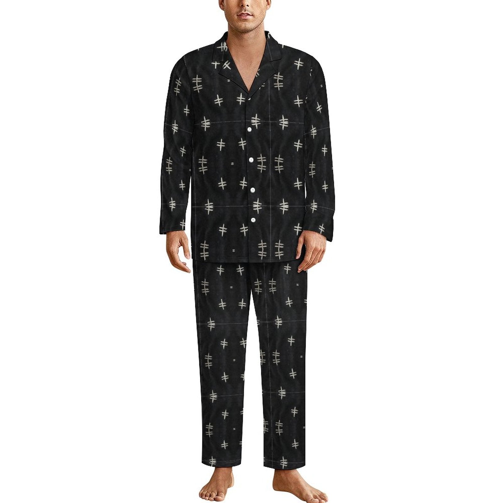 man wearing a set of sleep wears in black and white bogolan motif